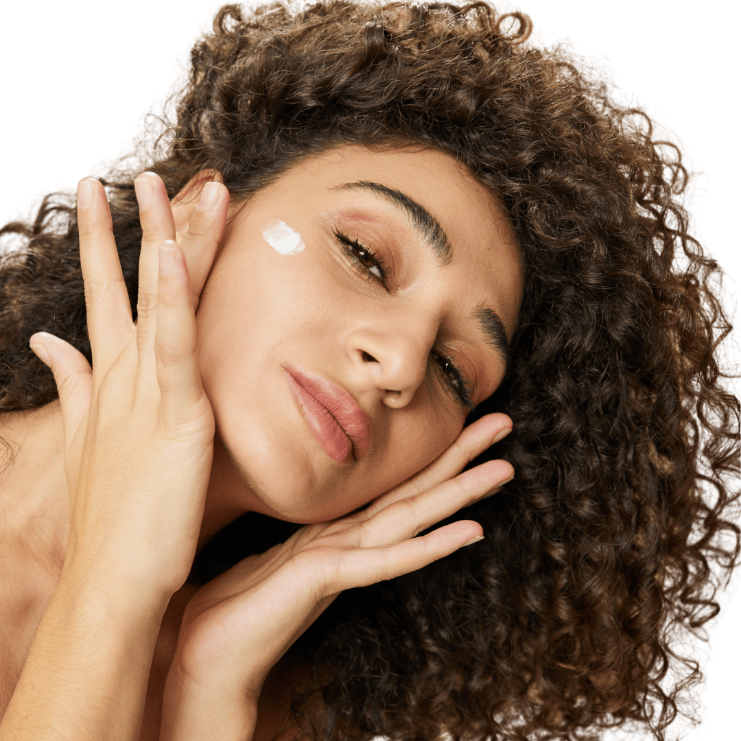 Girl applying mineral sunscreen